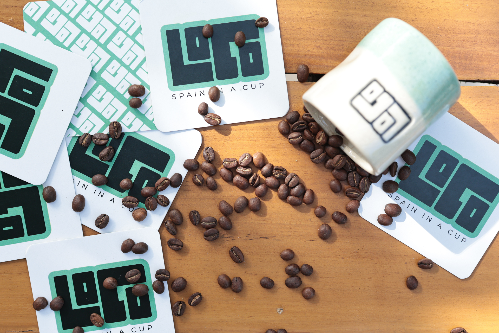 LOCO cards with freshly roasted Spanish coffee beans spilling across them